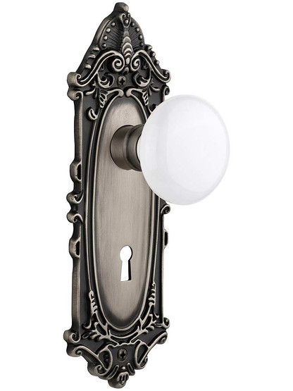 Largo Door Set with White Porcelain Knobs and Keyhole - 2 3/8 in Antique Pewter.